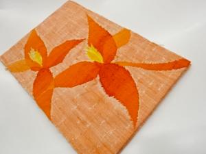 未使用品　手織り真綿紬花模様織出し名古屋帯